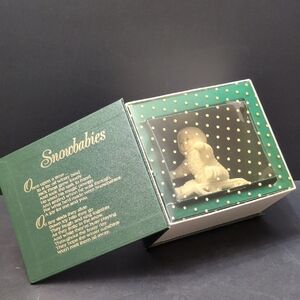 Department 56 Winter Tales Of The Snowbabies,Baby On Sled Figurine.